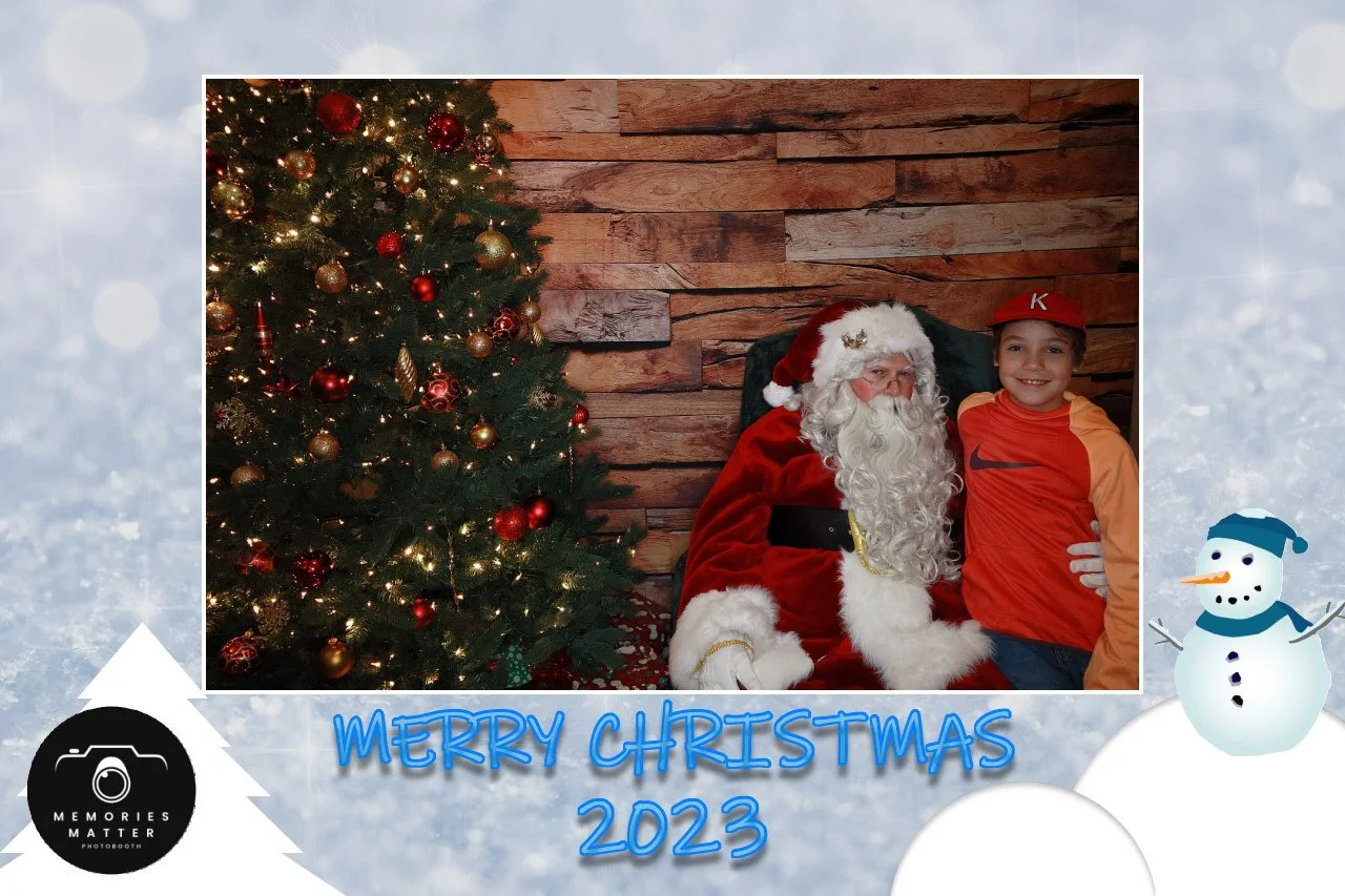 Guests posing with Santa at a holiday photobooth