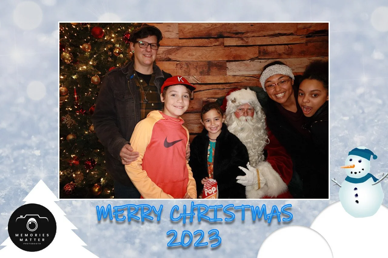 Children visiting Santa at the Christmas photobooth