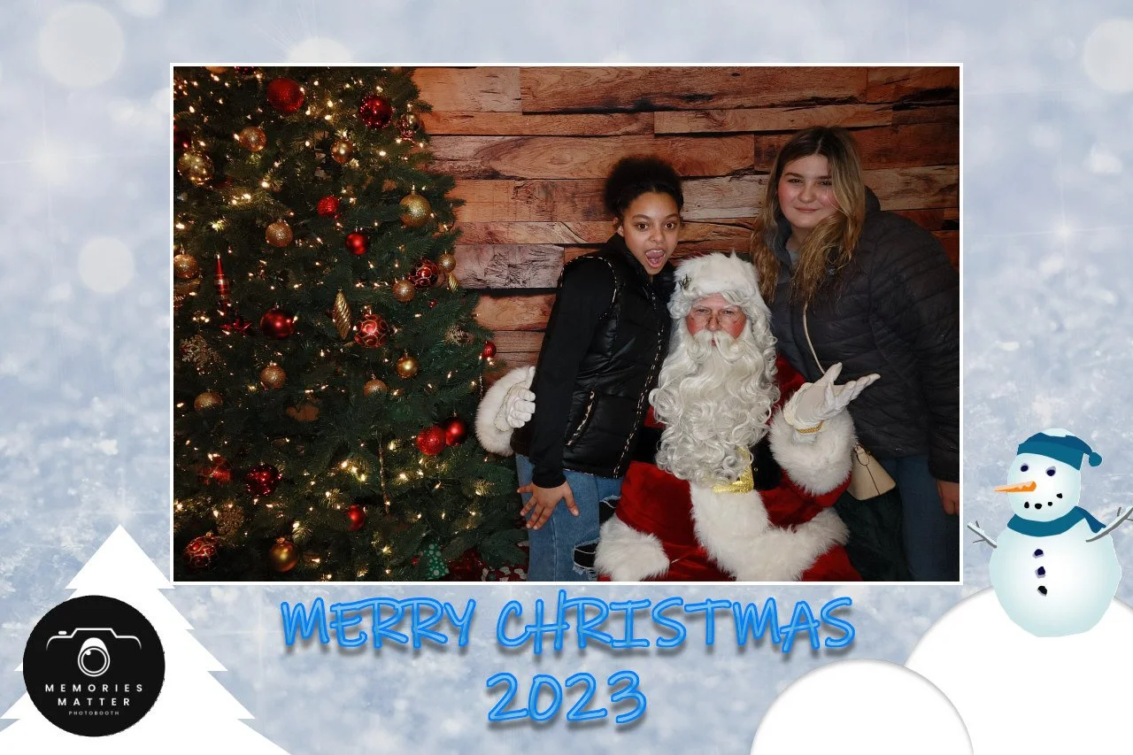A family celebrating the holidays at the Memories Matter photobooth