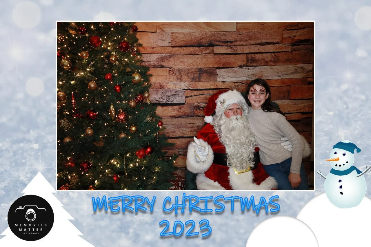 Guests smiling with Santa at a Kingsport holiday event