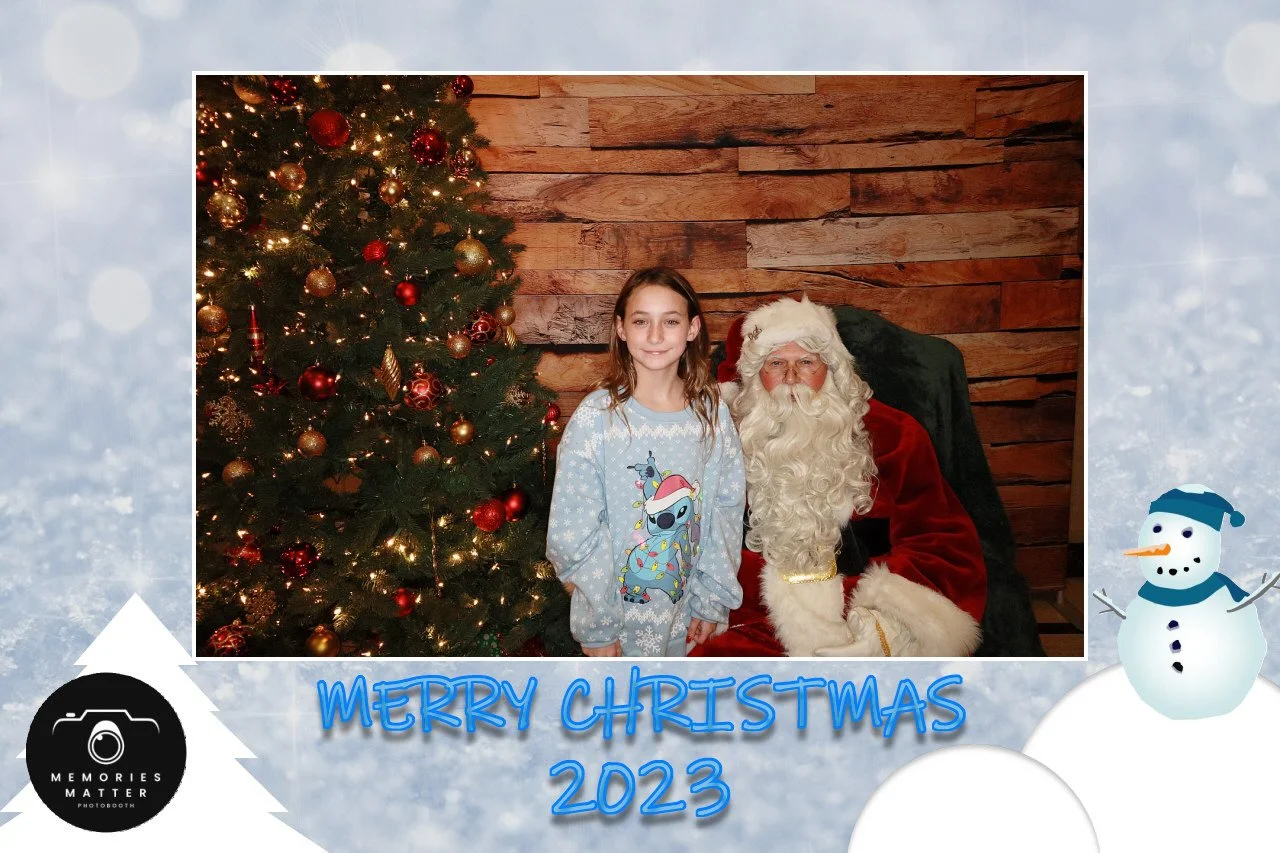 A family portrait with Santa at the Christmas photobooth