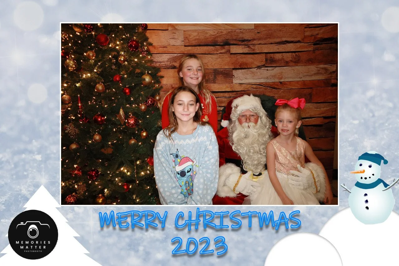 Guests laughing together at a holiday photobooth
