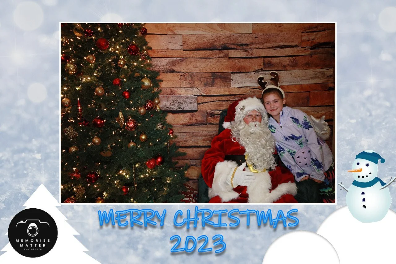 A joyful family with Santa at a Merry Christmas photobooth